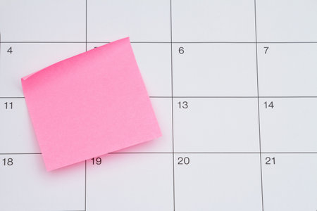 Appointment reminder with pick sticky note blank on a calendar