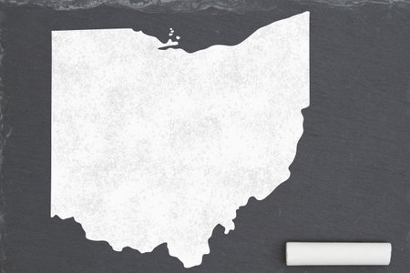 Learning about the state of Ohio USA, a map of the state of Ohio on a chalkboard with a piece of chalkの写真素材