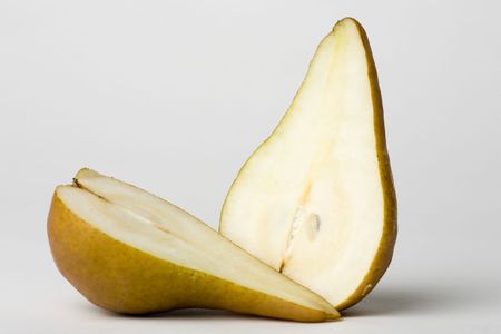 Pear cut in two halves showing juicy interiorの写真素材
