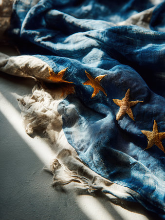 European flag lying on the ground, EU flag on asphalt, immigration, politics, for news, illegal immigration. High qualityの素材