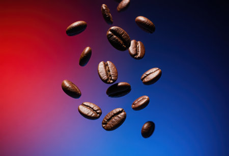 Freshly roasted coffee beans are captured in mid air, rich texture and deep brown color against warm background. This evokes sense of aroma and energy. High quality 4k footageの素材