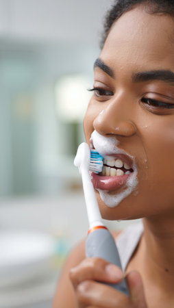 Brushing teeth with a toothbrush and toothpaste, Fresh breath, dental insurance, personal hygiene, brushing teeth in the morning, care from childhood, morning routine. High qualityの素材