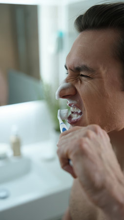 Brushing teeth with a toothbrush and toothpaste, Fresh breath, dental insurance, personal hygiene, brushing teeth in the morning, care from childhood, morning routine. High qualityの素材
