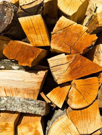 Wood blocks, logs for fireplace and fire, wooden background made of planks. High quality