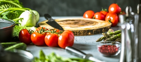 Chef cook preparing vegetables in his kitchen.の写真素材