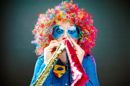 Portrait of beautiful party woman in wig and glasses Carneval Konzept