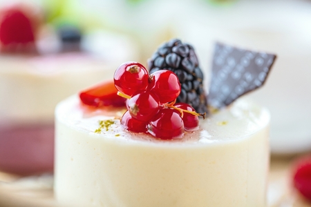 Sweet cakes with berries on table close-upの写真素材