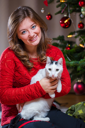 Woman Wrapping and Decorating Christmas Presentの写真素材