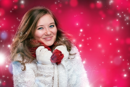 portrait of a sweet girl with a red scarf Christmas, close-upの写真素材