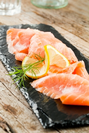 Smoked Salmon with Lemon and Dill selective focusの写真素材