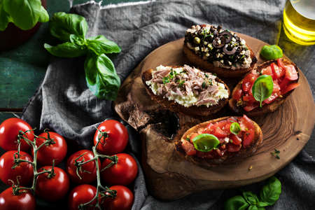 bruschetta, on slices of toasted baguette garnished with basilの写真素材