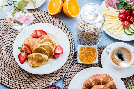 Breakfast served with coffee, orange juice and croissants
