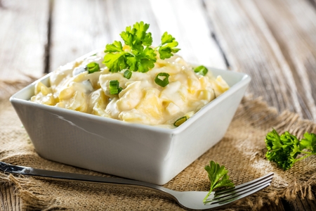 Potato salad with yoghurt and mayonnaise dressing with chives.の写真素材