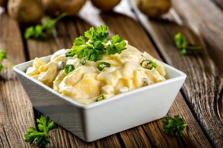 Potato salad with yoghurt and mayonnaise dressing with chivesの写真素材