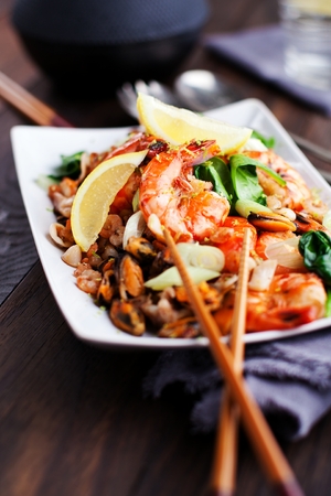 Seafood Salad with prawns, mussels, squids, octopus decorated with parsleyの写真素材