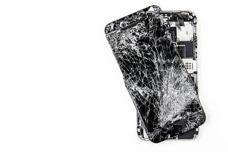 mobile phone with broken touchscreen on white backgroundの写真素材