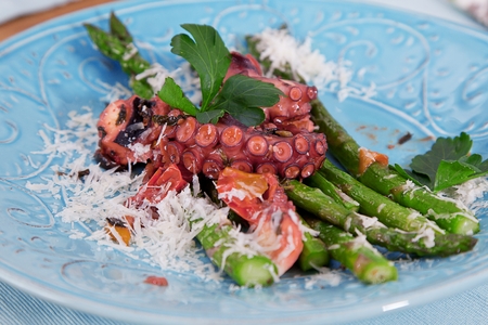 fresh octopus closeup on wooden rustic tableの写真素材