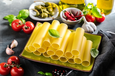 Fresh raw homemade Connelloni PASTA on Dark Tableの写真素材