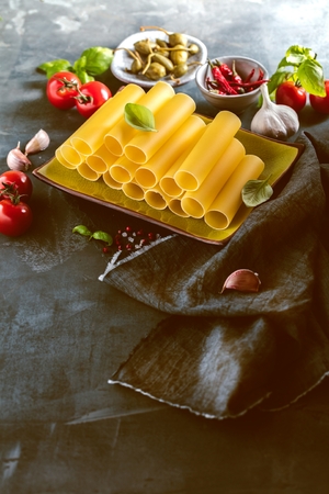 Fresh raw homemade Connelloni PASTA on Dark Tableの写真素材