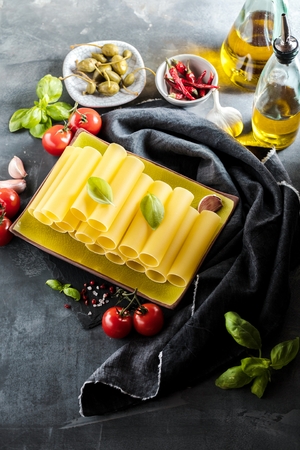 Fresh raw homemade Connelloni PASTA on Dark Tableの写真素材