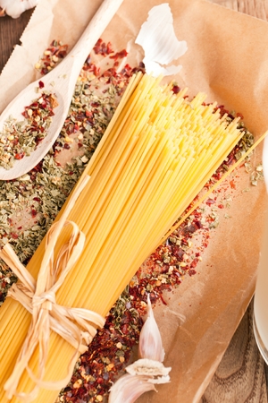 yellow long spaghetti on a rustic background. Yellow italian pasta. Long spaghettiの写真素材