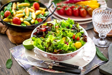Vegetable salad bowl on kitchen table. Balanced diet