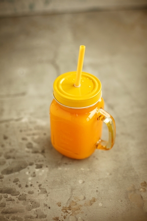 Healthy smoothies with fresh ingredients on a kitchen board.の写真素材