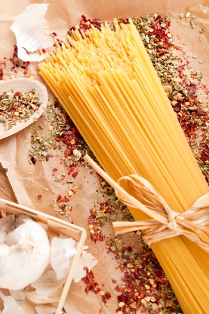 yellow long spaghetti on a rustic background. Yellow italian pasta. Long spaghettiの写真素材