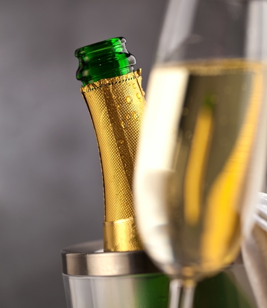 champagne glasses and bottle on dark backgroundの写真素材