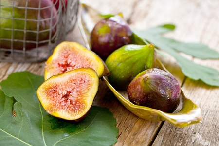 Freshly cut Fig Fruit on wooden background.の写真素材