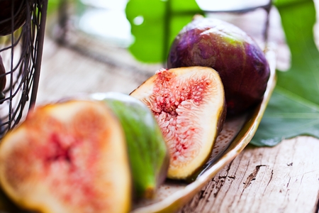 Freshly cut Fig Fruit on wooden background.の写真素材