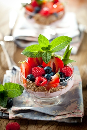 Summer dessert with strawberries on a wooden backgroundの写真素材