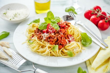 Fresh and delicious spagetti bolognese on wooden tableの写真素材