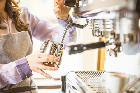 Close-up of espresso pouring from coffee machine. Professional coffee brewing.の写真素材
