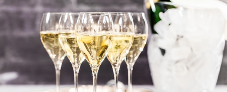 Bottle of champagne and filled glasses decorated in festive theme.の写真素材