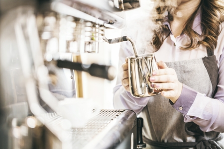 Close-up of espresso pouring from coffee machine. Professional coffee brewing.の写真素材