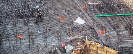 Construction workers fabricating steel reinforcement bar at the construction siteの写真素材