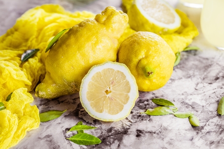 Fresh organic fruit - lemons on wood background selective focusの写真素材