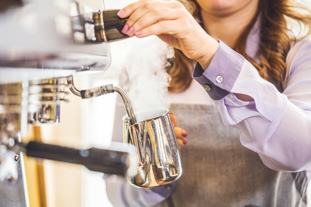 Close-up of espresso pouring from coffee machine. Professional coffee brewing.の写真素材