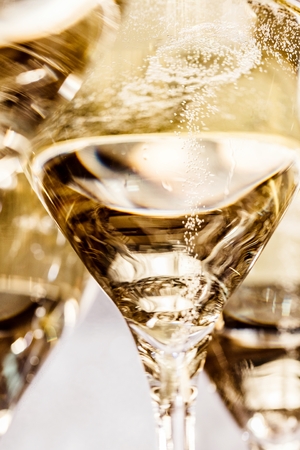 Bottle of champagne and filled glasses decorated in festive theme.の写真素材