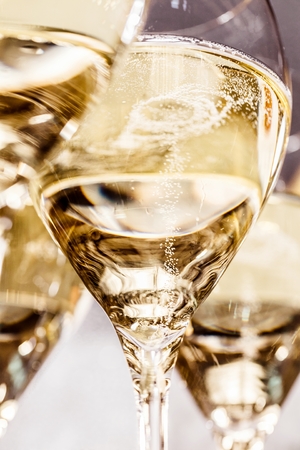 Bottle of champagne and filled glasses decorated in festive theme.の写真素材