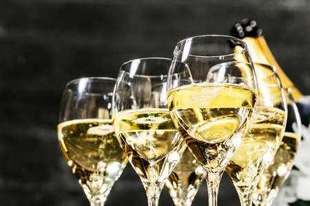 Bottle of champagne and filled glasses decorated in festive theme.の写真素材