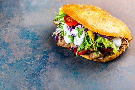 Delicious kebab sandwich on wooden background closeup.の写真素材