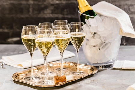 Bottle of champagne and filled glasses decorated in festive theme.の写真素材