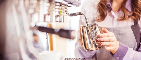 Close-up of espresso pouring from coffee machine. Professional coffee brewing.の写真素材