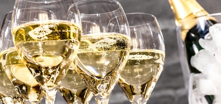 Bottle of champagne and filled glasses decorated in festive theme.の写真素材