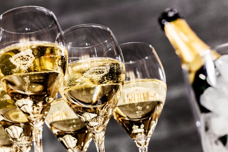 Bottle of champagne and filled glasses decorated in festive theme.の写真素材