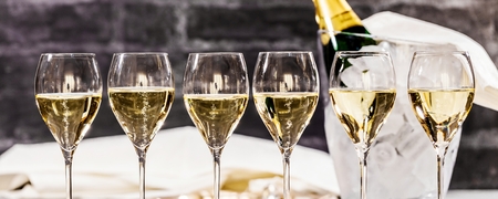 Bottle of champagne and filled glasses decorated in festive theme.の写真素材