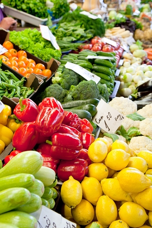 Fruit market with various colorful fresh fruits and vegetablesの写真素材