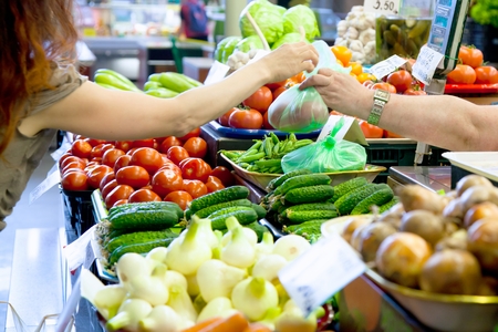 Fruit market with various colorful fresh fruits and vegetablesの写真素材